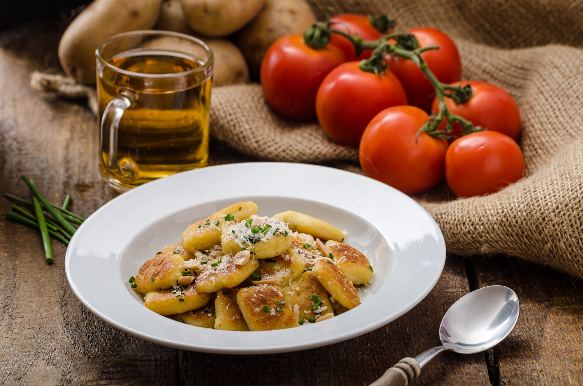 Homemade potato gnocchi with nuts and parmesan