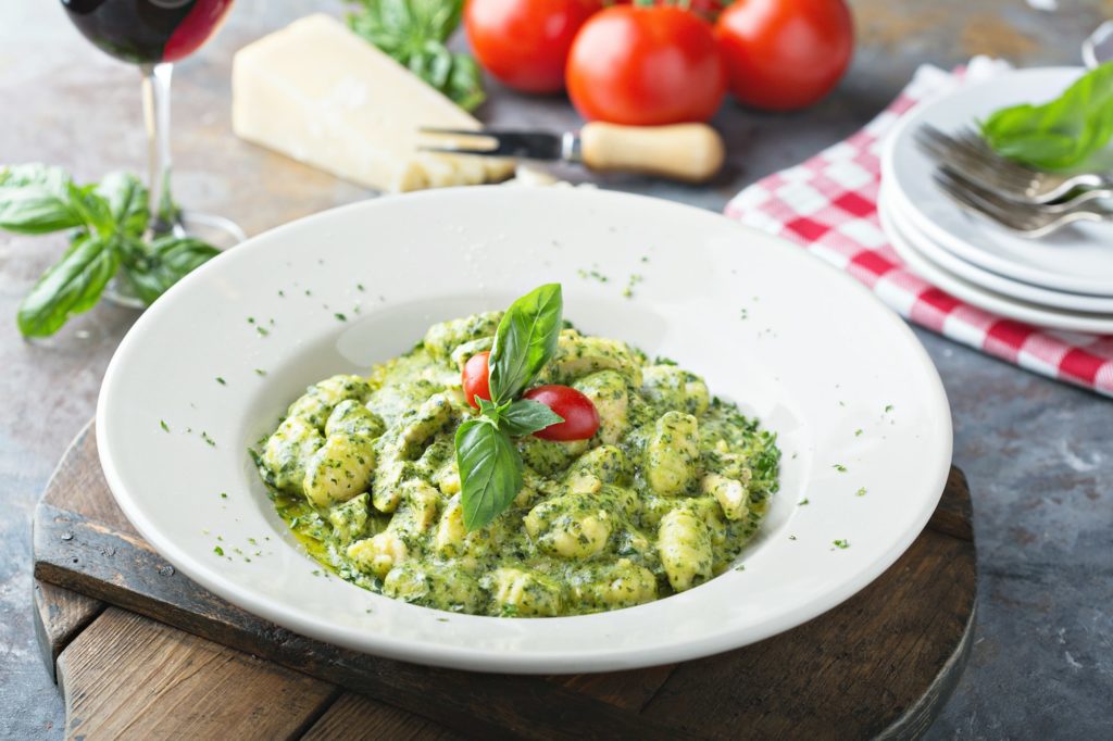 Freshly made gnocchi with pesto sauce