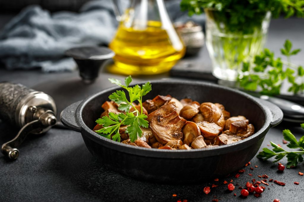 Fried mushrooms, champignons in pan